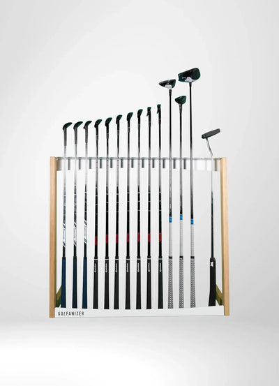 Modern golf club stand made of oak and white with several golf clubs, isolated